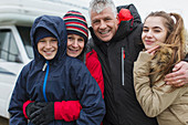 Portrait family outside motor home