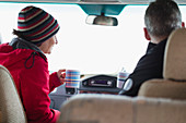 Couple drinking coffee in motor home