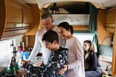 Family cooking in motor home