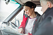 Couple looking at map in motor home