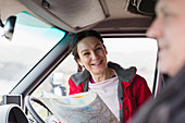 Couple with map, in motor home