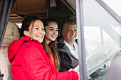 Portrait happy family with map in motor home