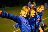 Portrait smiling, girls soccer team