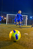 Girl soccer player practicing