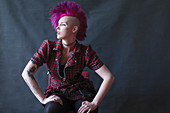 Portrait cool young woman with pink mohawk