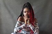 Portrait cool young woman with red braids