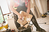 Construction worker plastering
