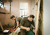 Construction workers working in house