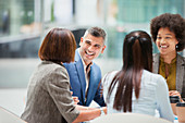 Business people laughing in meeting