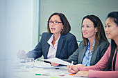 Attentive businesswomen listening in meeting