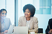 Confident businesswoman listening in meeting