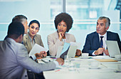 Attentive business people listening in meeting