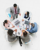 Businessman leading meeting at round table