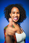 Young woman gesturing thumbs-up