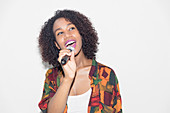 Woman with microphone singing