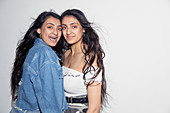 Portrait teenage twin sisters