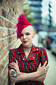 Young woman with pink mohawk