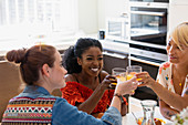 Women friends toasting cocktails