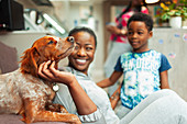 Mother and son petting dog