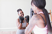 Mother and daughter boxing