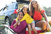 Portrait mother and daughters camping