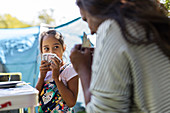 Mother and daughter playing card game