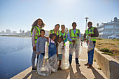 Portrait volunteers picking up litter on boardwalk