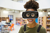 Portrait playful student wearing virtual reality glasses