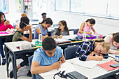 school students studying at desks