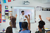 Smiling male teacher leading lesson