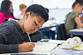 school boy student doing homework