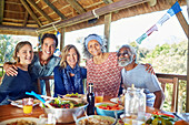 Portrait friends enjoying healthy meal in hut