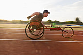 Teenage boy paraplegic athlete in wheelchair race
