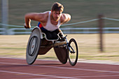 Determined paraplegic athlete in wheelchair race