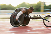 Determined paraplegic athlete in wheelchair race