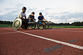 Portrait paraplegic athletes training for wheelchair race