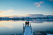 Couple holding hands, Lofoten Islands, Norway
