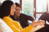 Couple reading book in bed