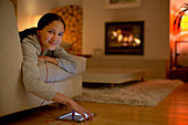 Young woman listening to music with headphones