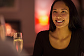 Happy young woman drinking champagne