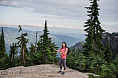 Portrait woman hiking at mountaintop, Canada