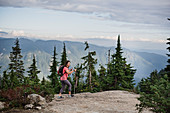 Woman hiking on mountaintop, Canada