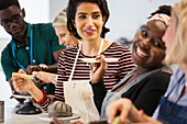 Happy friends enjoying art class