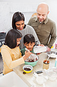 Family baking in kitchen