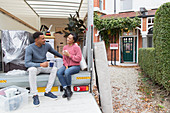 Couple talking and drinking tea