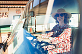 Portrait carefree woman driving van