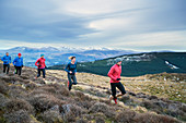 Friends jogging on mountain trail