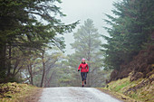 Woman hiking in woods