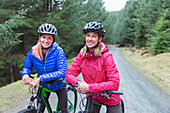 Mother and daughter mountain biking