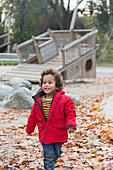 Smiling toddler boy walking